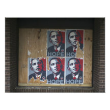 Obama signs in a boarded window of a closed photo print