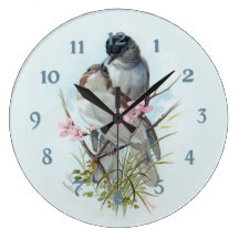 Oiseaux noirs de fauvette de casquette horloge murale