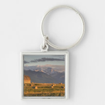 Old barn framed by hay bales and dramatic key chains