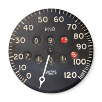 old speedometer gauge from a vintage race car fridge magnet