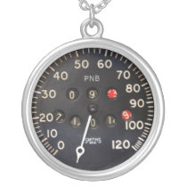 old speedometer gauge from a vintage race car necklaces