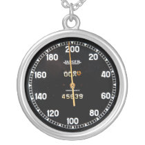 old speedometer gauge from a vintage race car pendant