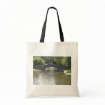 Old Stone Bridge With Water Flowing Gently By The Tote Bag