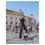 On stilts in a festival flyers