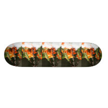 Orange flowers and rusted chain close up skateboard deck