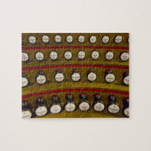 Organ stops jigsaw puzzle in a tin