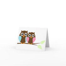 Owl couple on a branch
