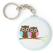 Owl couple on a branch