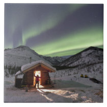 Person stands in doorway of Caribou Bluff cabin 2 tiles