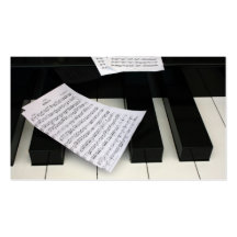 Piano keys with music business cards