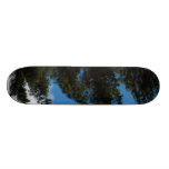 Pine Tree Agains The Blue Sky With Some Cloulds Skateboard Deck