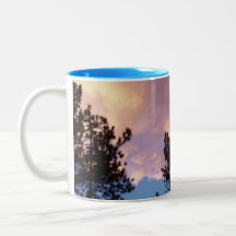 Pine trees and clouds in sunset coffee mug