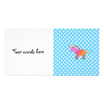 Pink and orange unicorn on blue polka dots