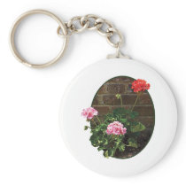 Pink and Red Geraniums Against Brick