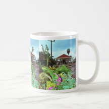 Pink Tropical flowers grace the entrance of a reso Coffee Mugs