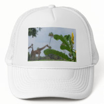 Plant and blue sky with giraffes in the background trucker hat