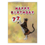 Playful cat and 77th Happy Birthday balloons Cards