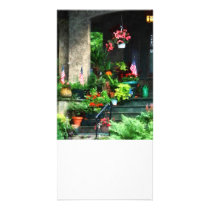 Porch With Geraniums and American Flags