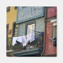Portugal, Oporto (Porto). Woman hanging laundry Refrigerator Magnet