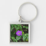 Pretty purple flower against dark background key chain