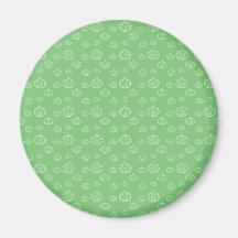 Pumpkins on green refrigerator magnets
