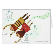 Rear view of a couple flying together greeting cards