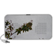 Red flowering plant against the sky portable speaker