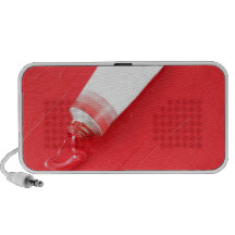 Red oil paint spilling out of tube notebook speakers