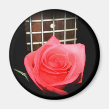 Red pink rose against five string bass fret board magnets