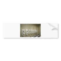 restroom interior with urinal row bumper sticker