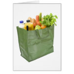 Reusable shopping bag full of groceries cards