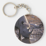 Rhino drinking at a watering place keychain