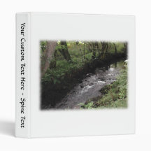 River flowing through woodland. binders