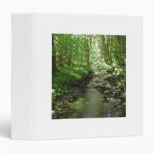 River flowing through woodland. binders