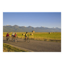 Road bicyclists ride down a back country road
