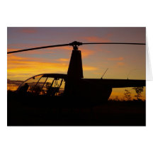 Robinson R44 helicopter at sunset Cards