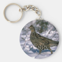 Ruffed grouse standing in snowy woods key chains