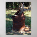 Rusted garbage can in grassy landscape poster