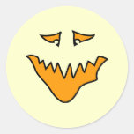 Scary Face. Orange Monster Grin. Round Sticker
