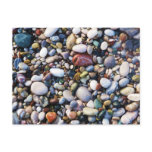 Sea pebbles and stones on a beach close up postcards