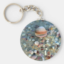 Sea shells on sandy beach keychains