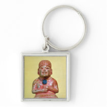 Seated figure, possibly one  earliest keychains