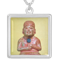 Seated figure, possibly one  earliest necklaces