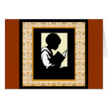 Silhouette of boy reading card