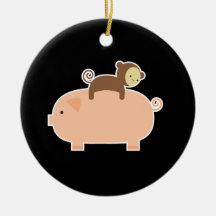 Singe de bébé montant vers l'arrière sur un porc décorations pour sapins de noël
