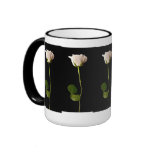 Single white rose on a black background coffee mugs