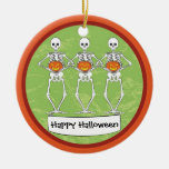 Skeletons holding pumpkins christmas tree ornament