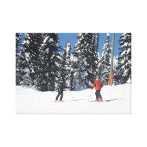 Skiers on a Mountain with Snow Covered Trees Stretched Canvas Print