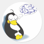 sleeping penguin dreaming about fish sticker