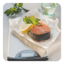 Slice of salmon on weight scale square sticker